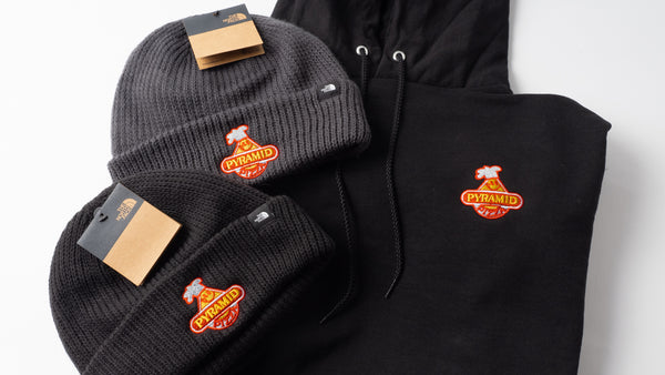Beanie-style hats and black hoodie with matching custom logo embroidery